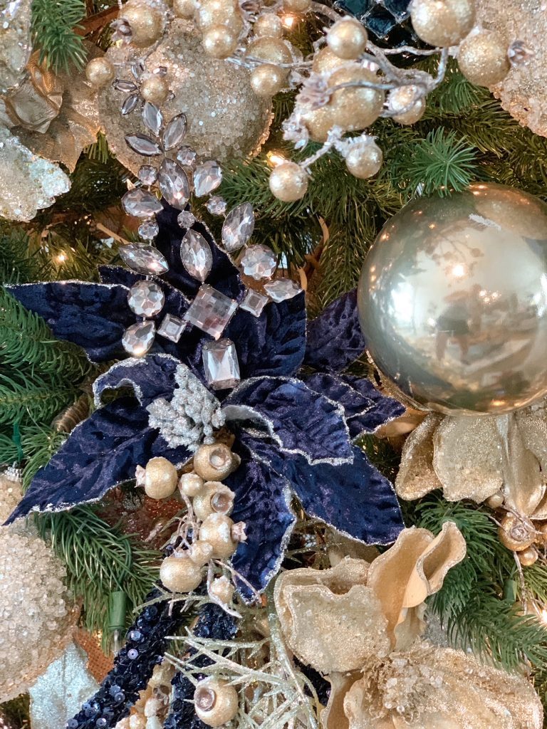 Textured Navy Poinsettia Ornament on Christmas Tree — Blue Christmas Decor