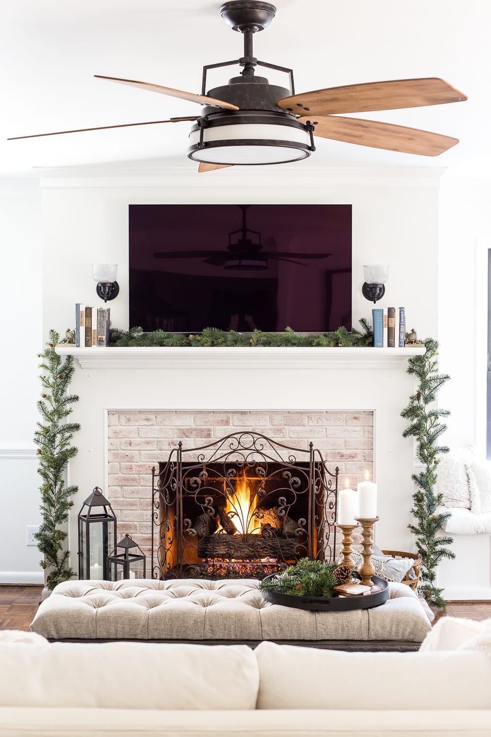 Farmhouse Living Room Fireplace with Roaring Fire and Evergreen Garland — Winter Decor After Christmas