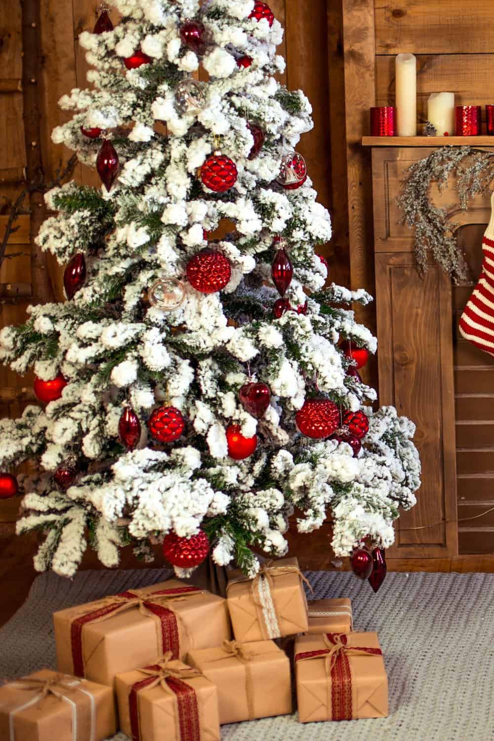 Classic Flocked Tree with All-Red Ornaments and Gifts — Flocked Christmas Tree Decor