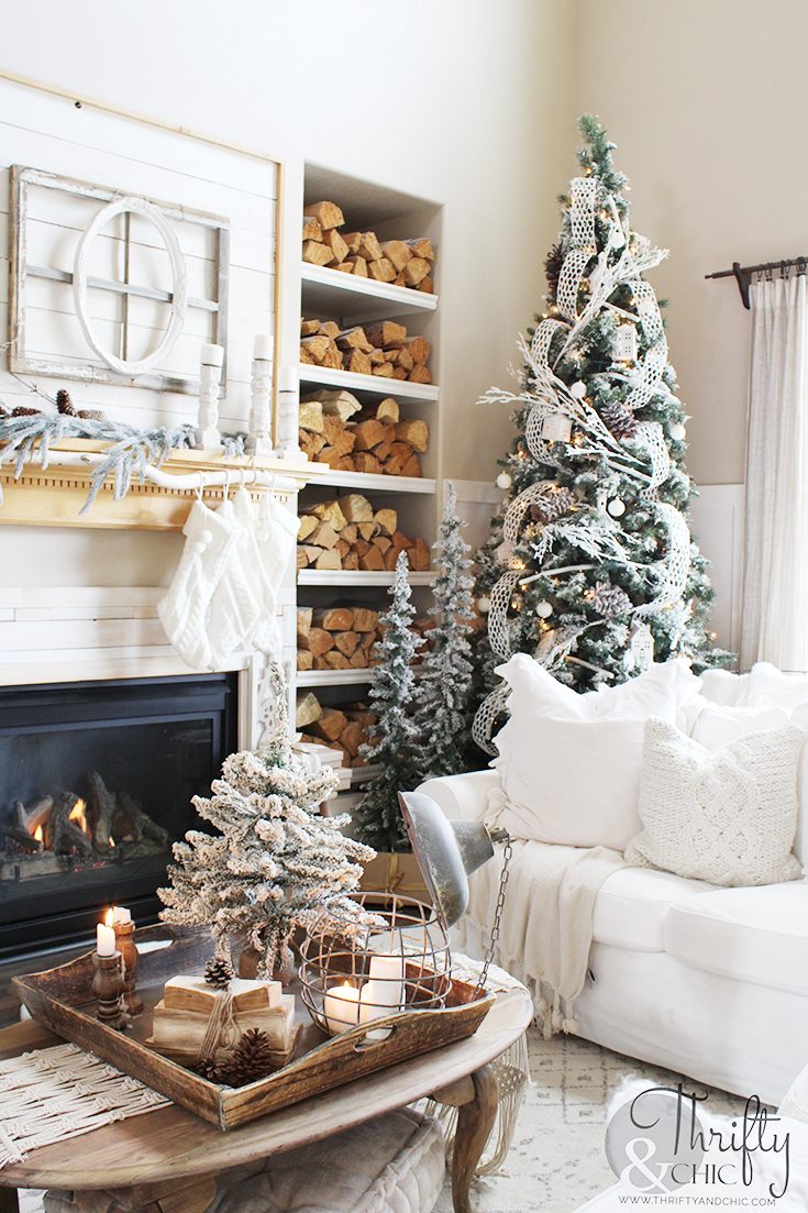 Cozy Cottage Living Room with Multiple Christmas Trees and Stacked Logs Cozy Cottage Living Room with Multiple Christmas Trees and Stacked Logs — Cozy Christmas Living Room