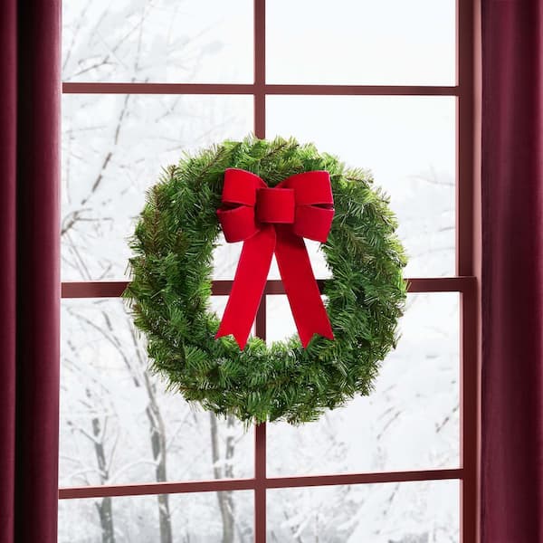 Traditional Evergreen Wreath with Red Velvet Bow on a Multi-Paned Window — Christmas Window Wreaths