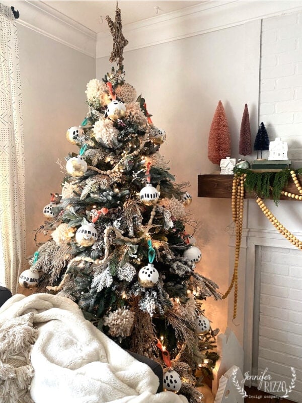 Flocked Boho Christmas Tree with Textured Ornaments and Neutral Tones — Boho Christmas Decor