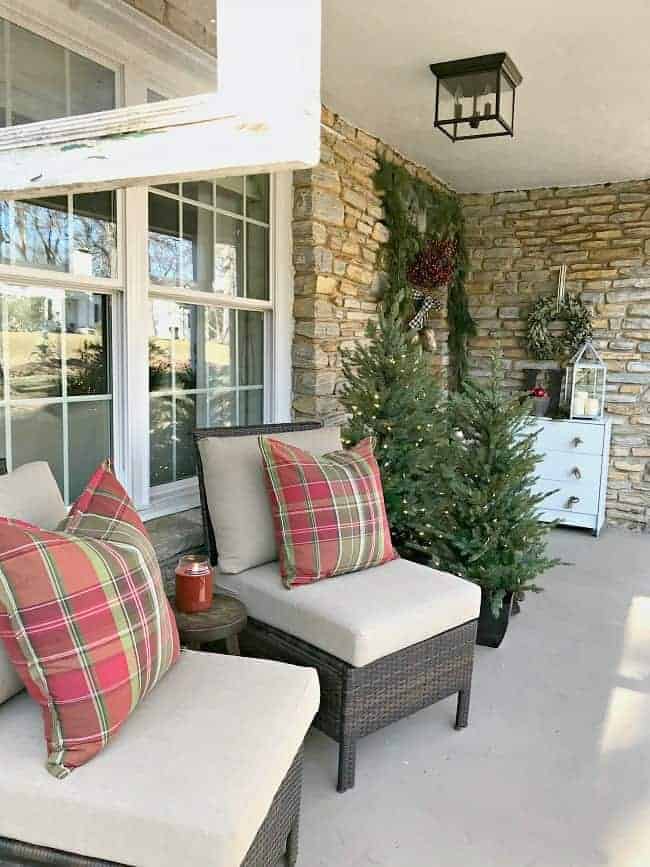 Cozy Seating with Plaid Cushions and Decorative Trees Cozy Seating with Plaid Cushions and Decorative Trees — Small Christmas Porch
