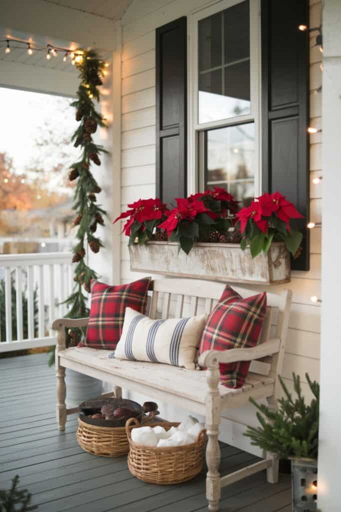 Cozy Farmhouse Porch Seating with Plaid Pillows and Greenery — Farmhouse Christmas Porch