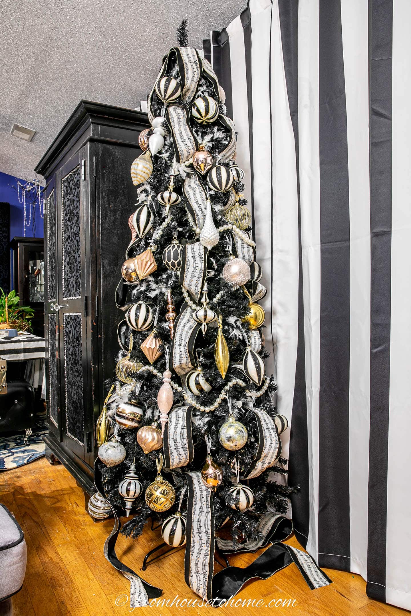 Art Deco Black Flocked Christmas Tree with Striped Ornaments Art Deco Black Flocked Christmas Tree with Striped Ornaments — Black and Gold Christmas Tree