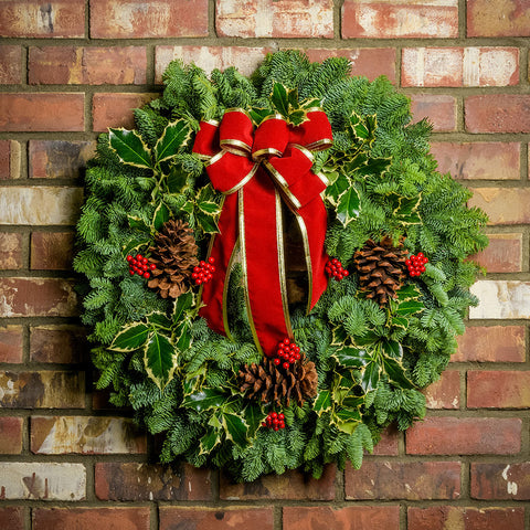 Classic Evergreen Wreath with a Bold Red Velvet Bow on a Brick Wall — Simple Christmas Outdoor Decor
