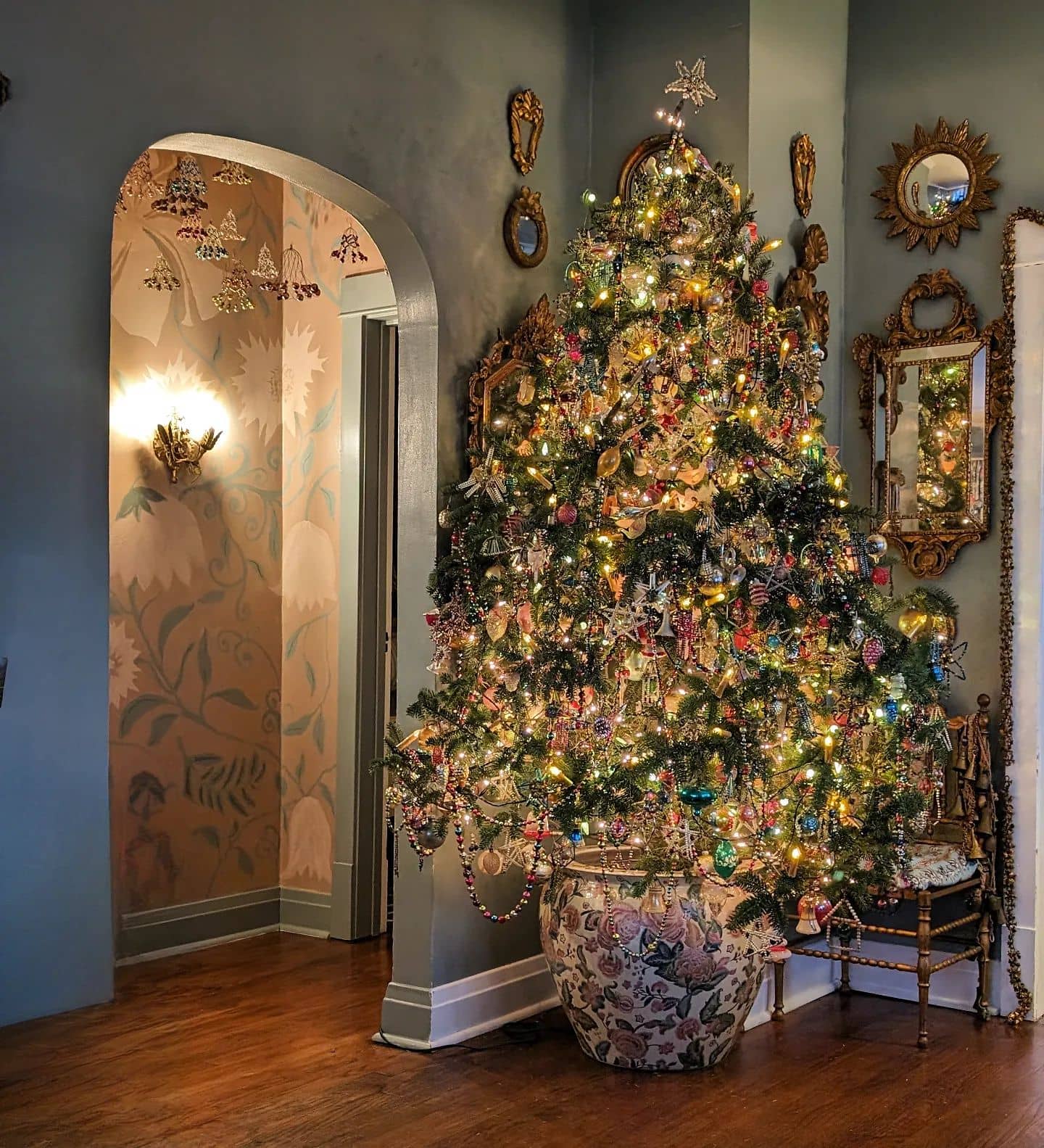 Eclectic Vintage Christmas Tree in Ornate Vase with Diverse Ornaments