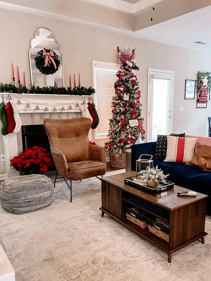 Festive Fireplace Garland and Stockings in a Neutral Living Room Festive Fireplace Garland and Stockings in a Neutral Living Room — Cozy Christmas Living Room