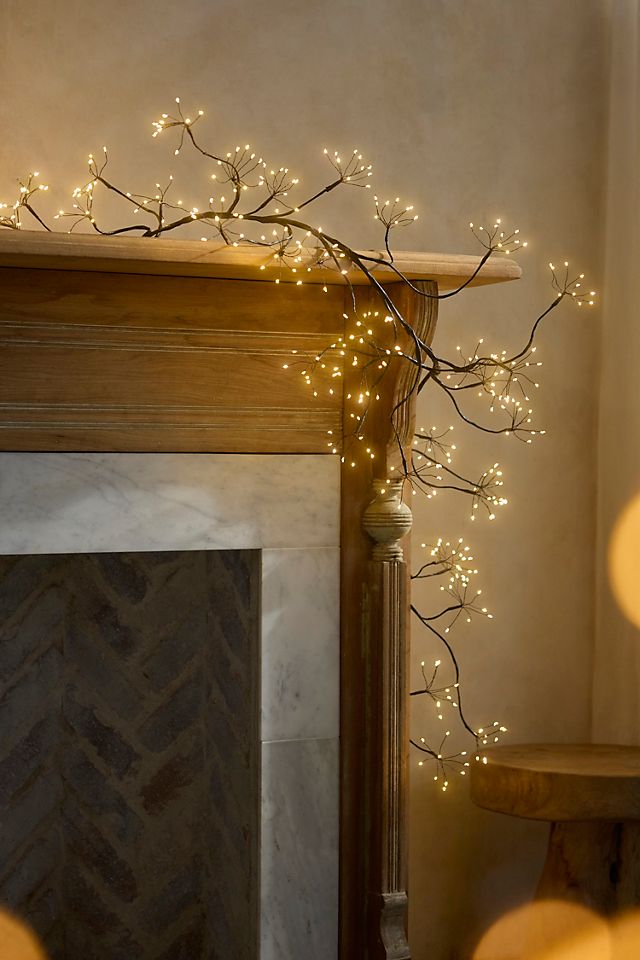 Minimalist LED Branch Garland on Mantelpiece Minimalist LED Branch Garland on Mantelpiece — Christmas Lights in Garland Indoor