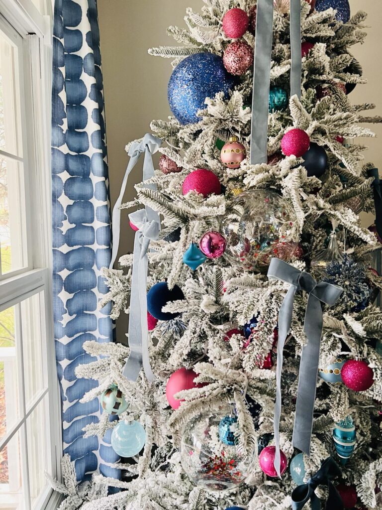 Modern Flocked Tree with Vibrant Pink, Blue, and Teal Ornaments — Flocked Christmas Tree Decor