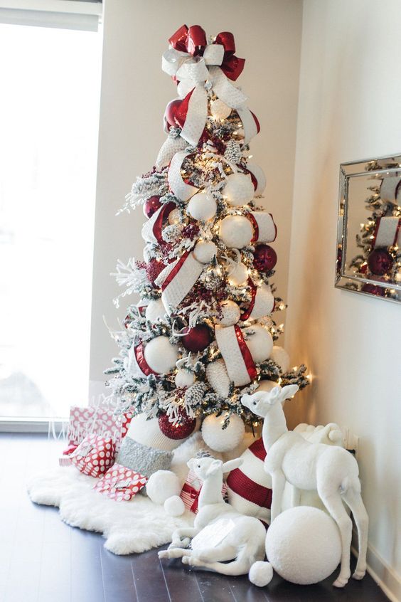 Tall Flocked Christmas Tree with Red and White Ribbon and Glamorous Accents Tall Flocked Christmas Tree with Red and White Ribbon and Glamorous Accents — Red and White Christmas Tree