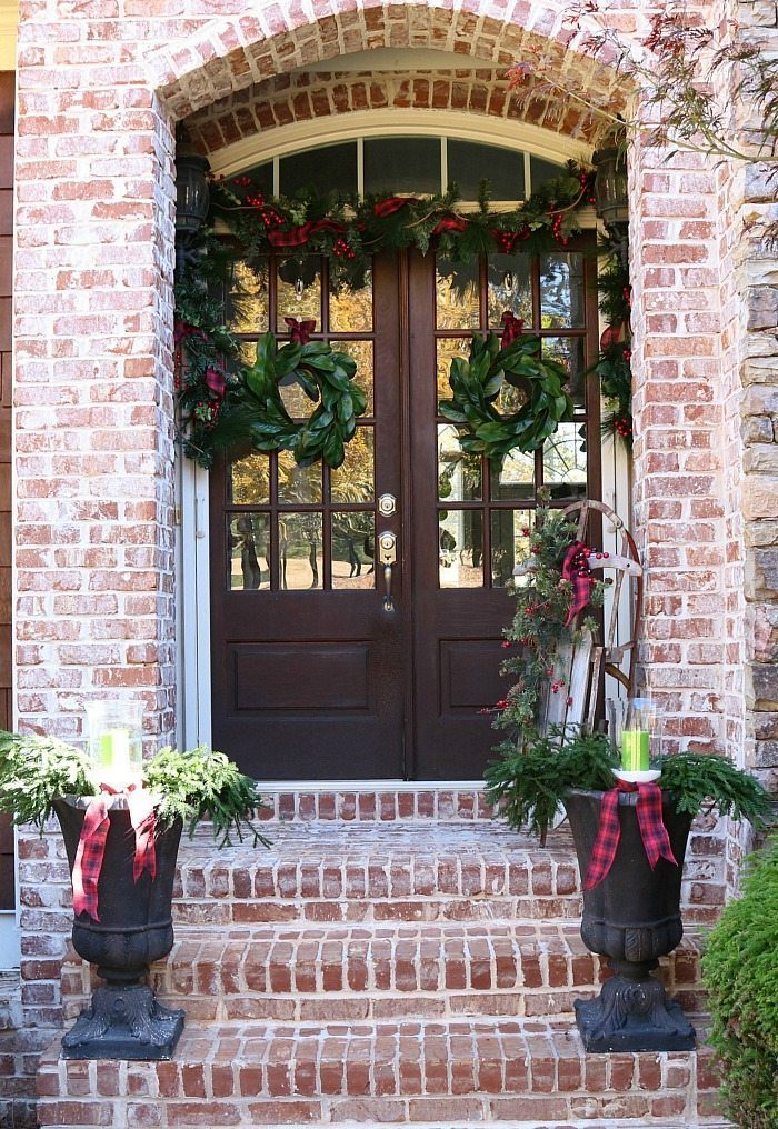 Brick Farmhouse Porch with Double Wreaths and Urn Planters — Farmhouse Christmas Porch