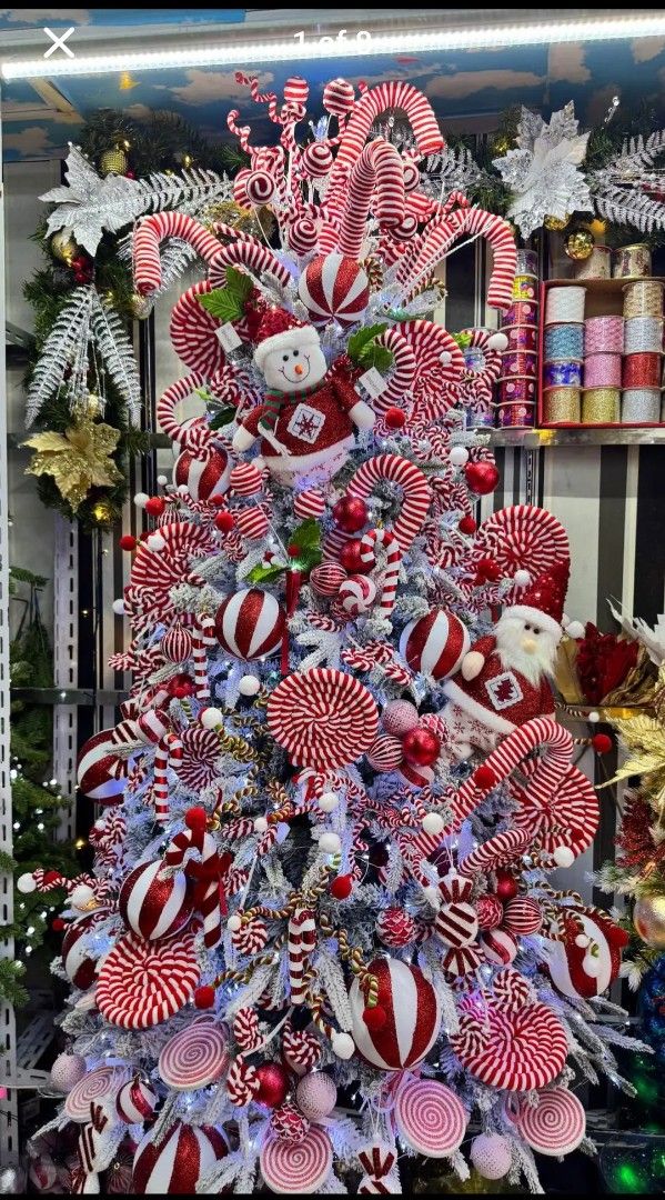 Red and White Candy Cane Focus on Flocked Tree Red and White Candy Cane Focus on Flocked Tree — Candy Land Christmas Tree