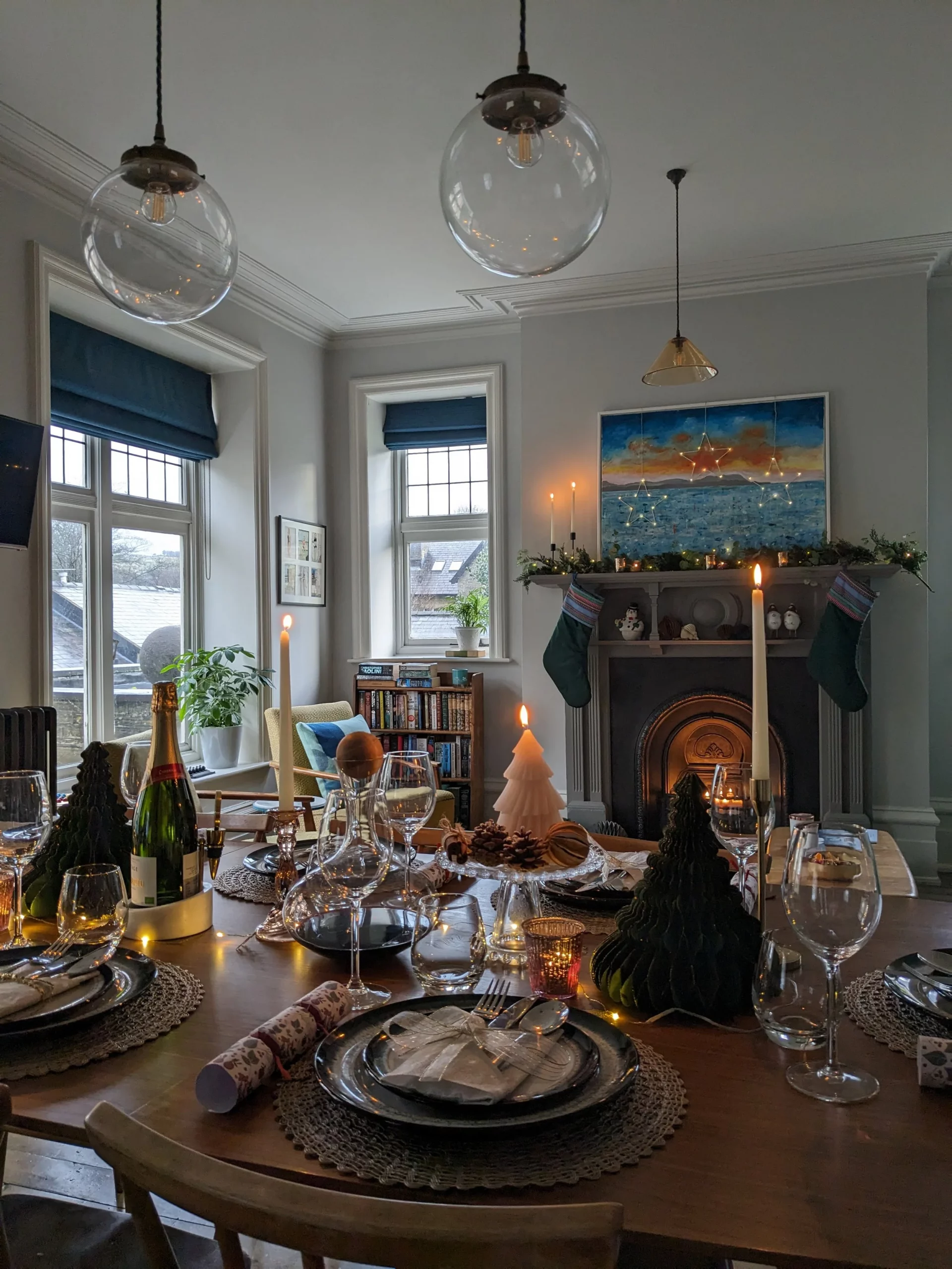 Modern Eclectic Dining Room with Fireplace and Stockings — Christmas Dining Room Decor