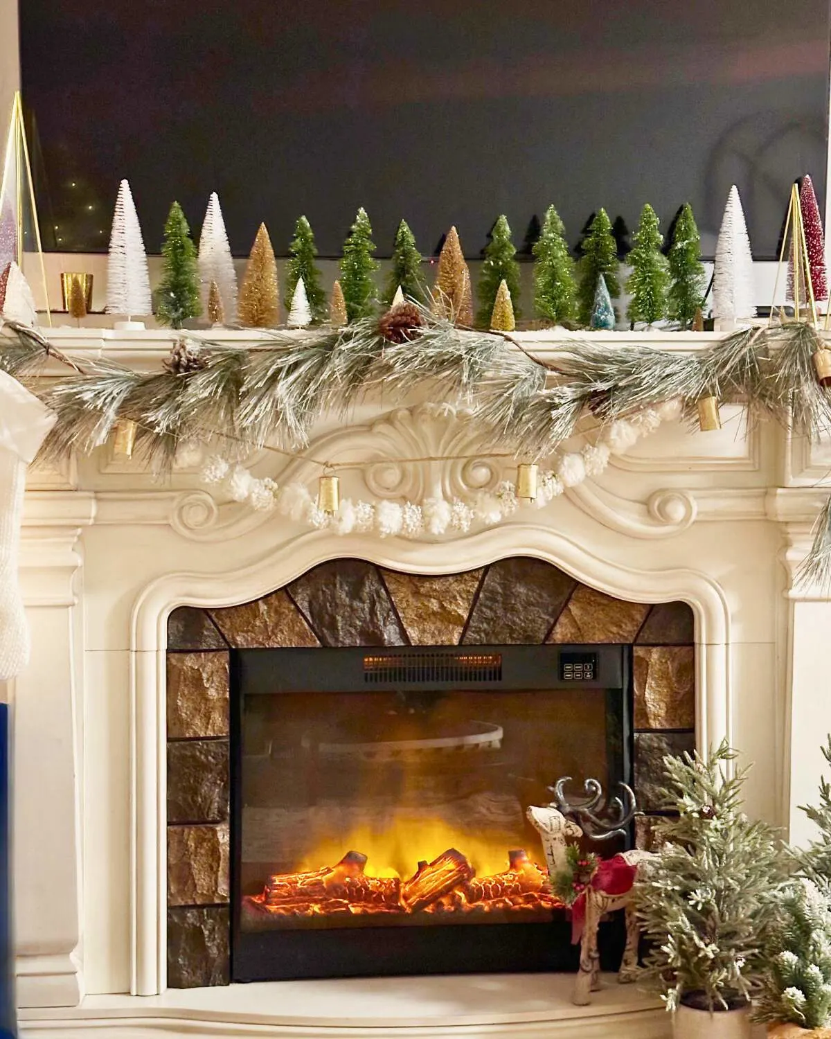 Ornate White Fireplace with Reindeer and Mini Trees Ornate White Fireplace with Reindeer and Mini Trees — Christmas Fireplace Decor