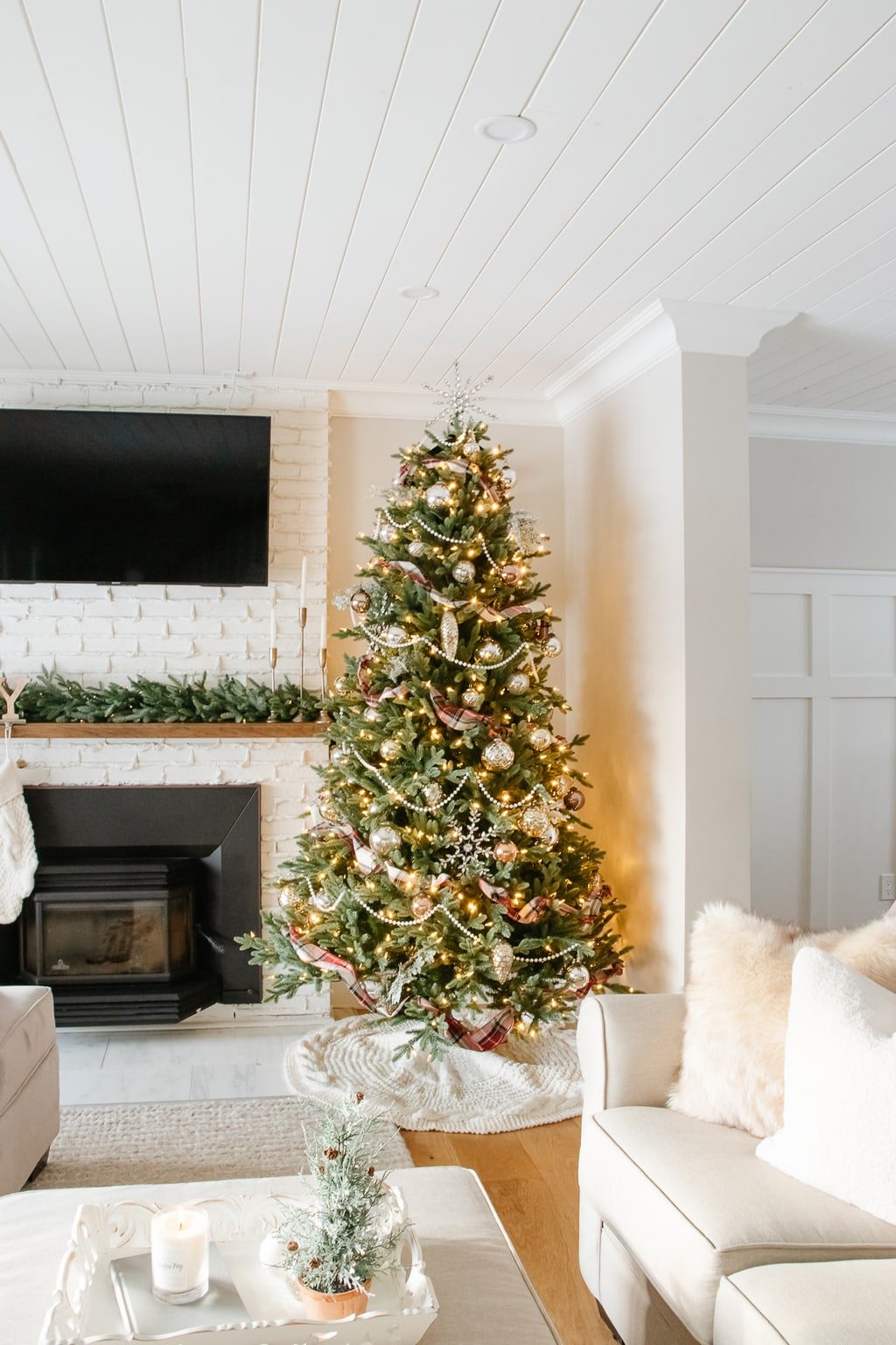 Plaid Ribbon Accents on a Farmhouse Christmas Tree by Fireplace