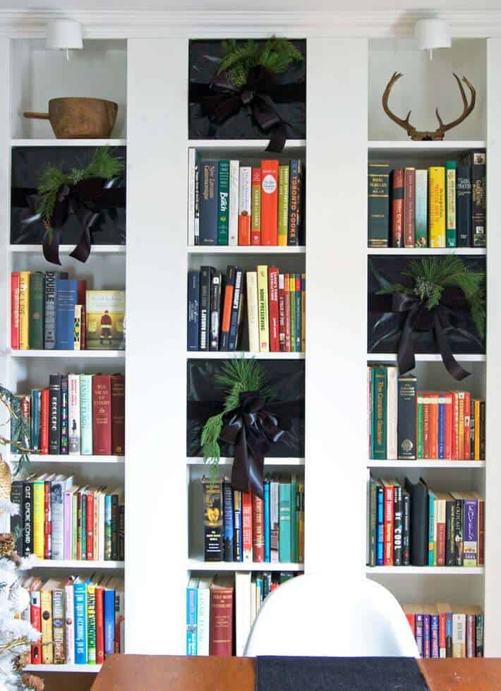 Farmhouse Bookshelf with Black Bows and Antlers Farmhouse Bookshelf with Black Bows and Antlers — Christmas Bookshelf Decor