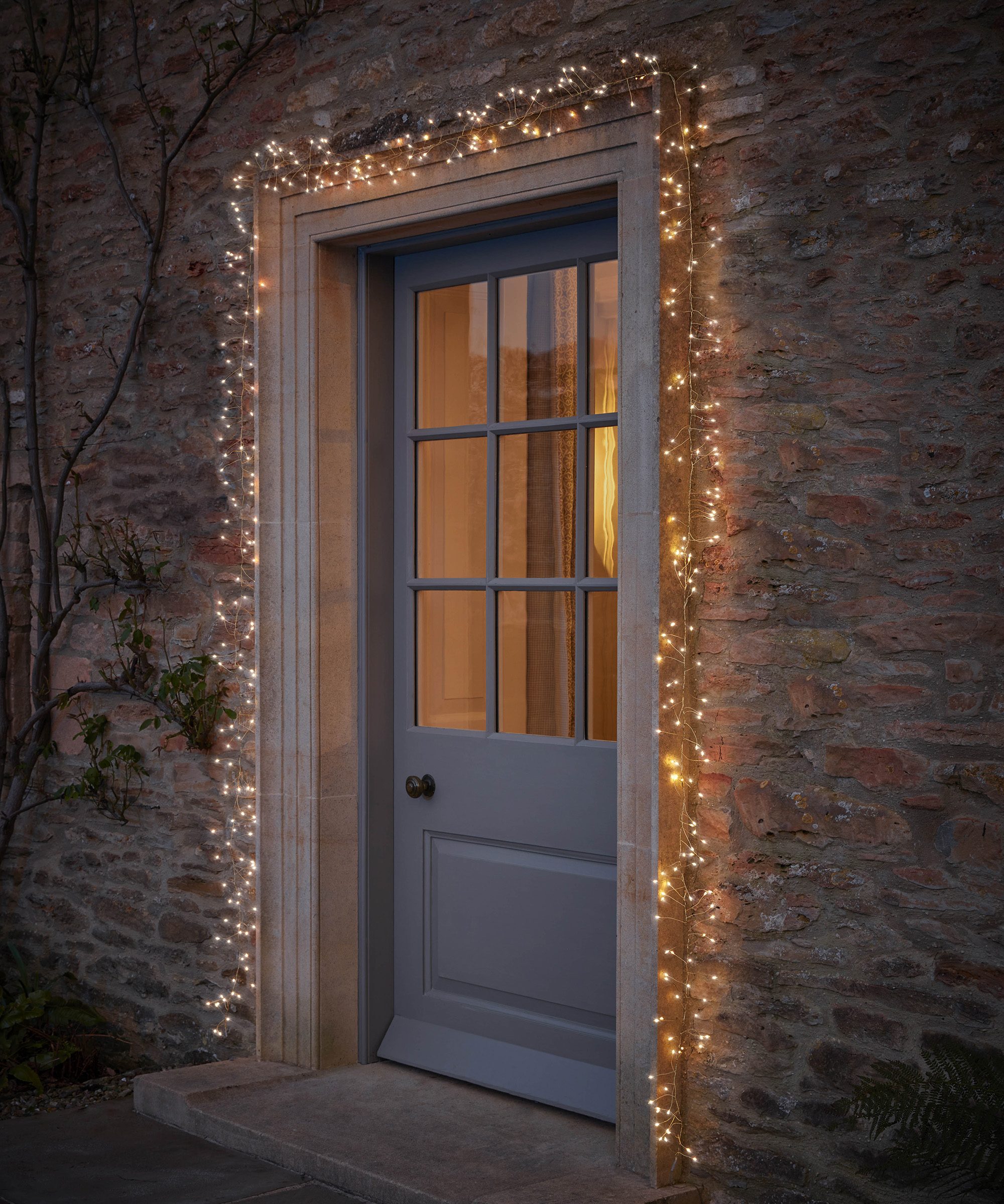 Cozy Doorway Framed by Warm White String Lights — Christmas Door Frame Lights
