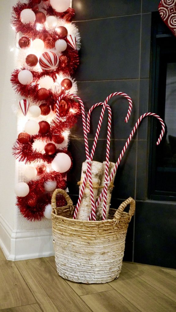 Cozy Corner Display Featuring Candy Canes in a Birch Log Basket — Candy Cane Christmas Decor