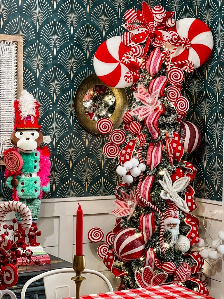 Tree To The Side Table In Foreground Whimsical Christmas Tree with Red and White Candy-Themed Ornaments and Nutcracker Tree To The Side Table In Foreground Whimsical Christmas Tree with Red and White Candy-Themed Ornaments and Nutcracker — Red