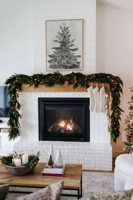Modern Farmhouse Fireplace with Evergreen Garland and Fairy Lights Modern Farmhouse Fireplace with Evergreen Garland and Fairy Lights — Christmas Fireplace Decor