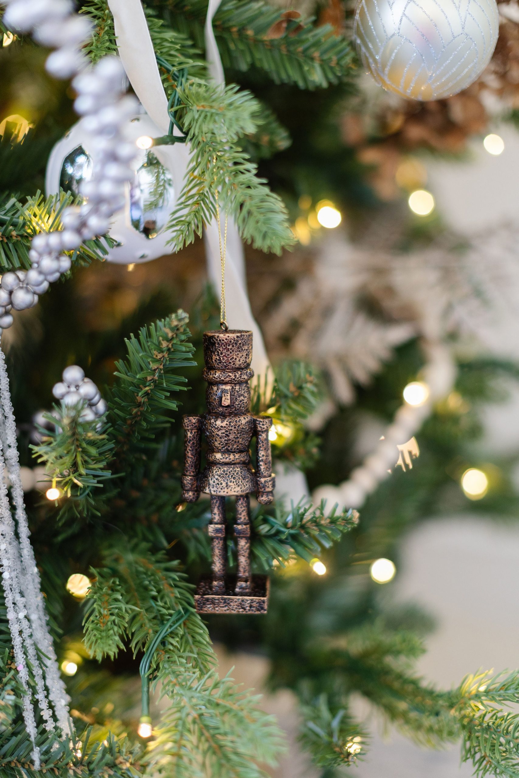 Bronze Nutcracker Ornament with Bokeh Lights Bronze Nutcracker Ornament with Bokeh Lights — Nutcracker Christmas Tree