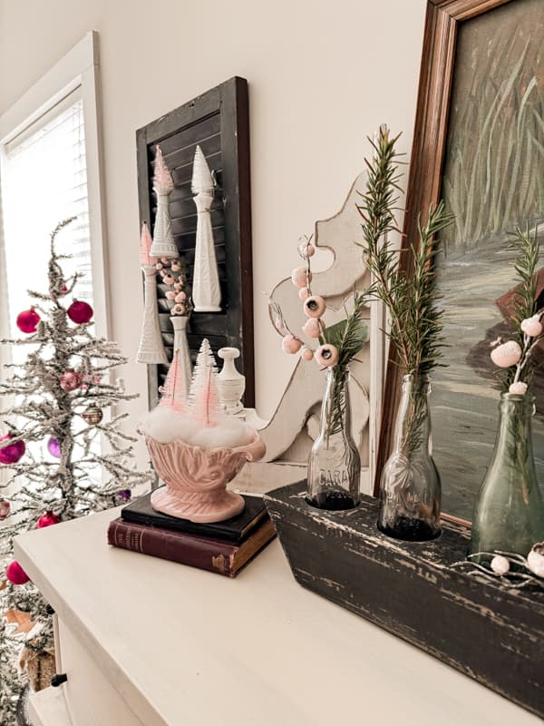 Vintage Mantelpiece Display Featuring Pink and White Decorative Trees Vintage Mantelpiece Display Featuring Pink and White Decorative Trees — Pink Christmas Decor