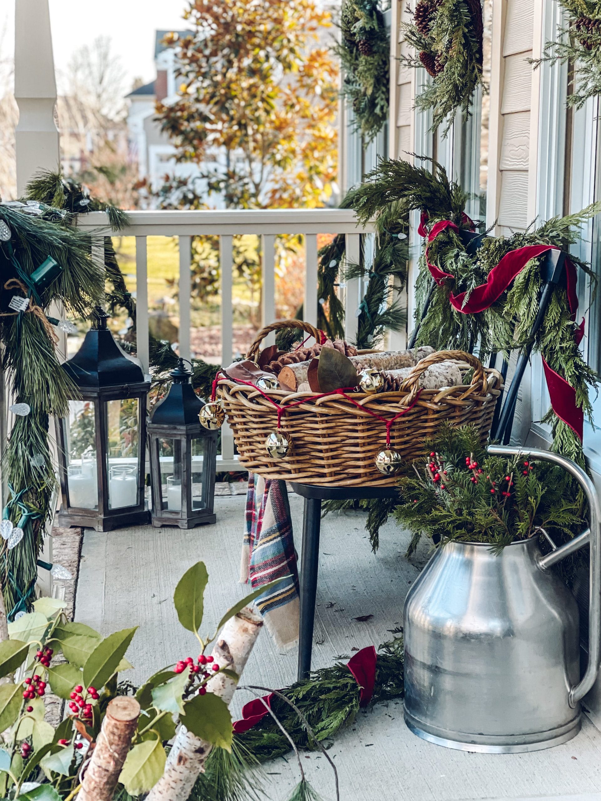 Abundant Evergreen Garlands and Red Ribbon Accents — Christmas Porch Decor
