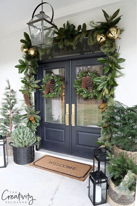 Luxurious Black Double Doors with Abundant Greenery and Gold Bells Luxurious Black Double Doors with Abundant Greenery and Gold Bells — Christmas Front Door Decor