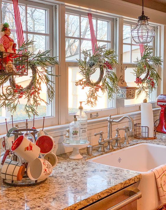 Farmhouse Sink Area Accented with Miniature Wreaths and Mugs Farmhouse Sink Area Accented with Miniature Wreaths and Mugs — Christmas Kitchen Decor