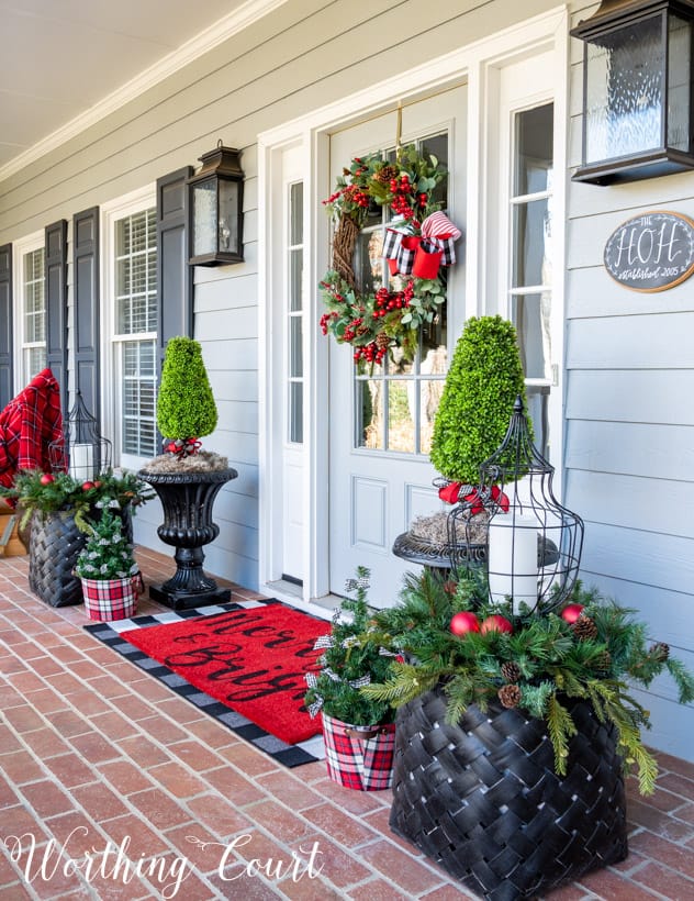 Traditional Porch with Greenery Planters and Plaid Accents — Christmas Porch Decor