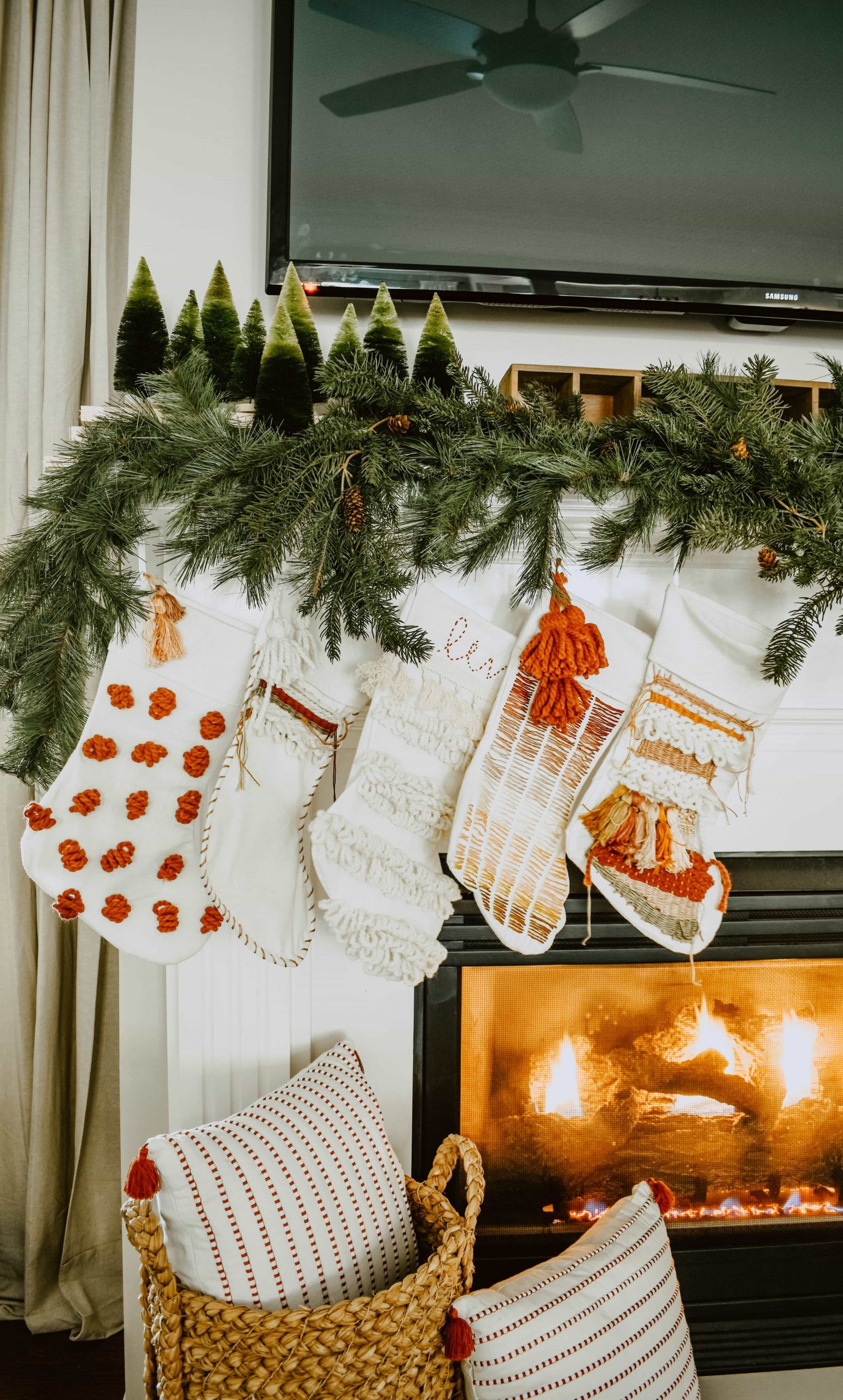 Boho Christmas Stockings with Macrame and Fringe on Fireplace Mantle — Boho Christmas Decor