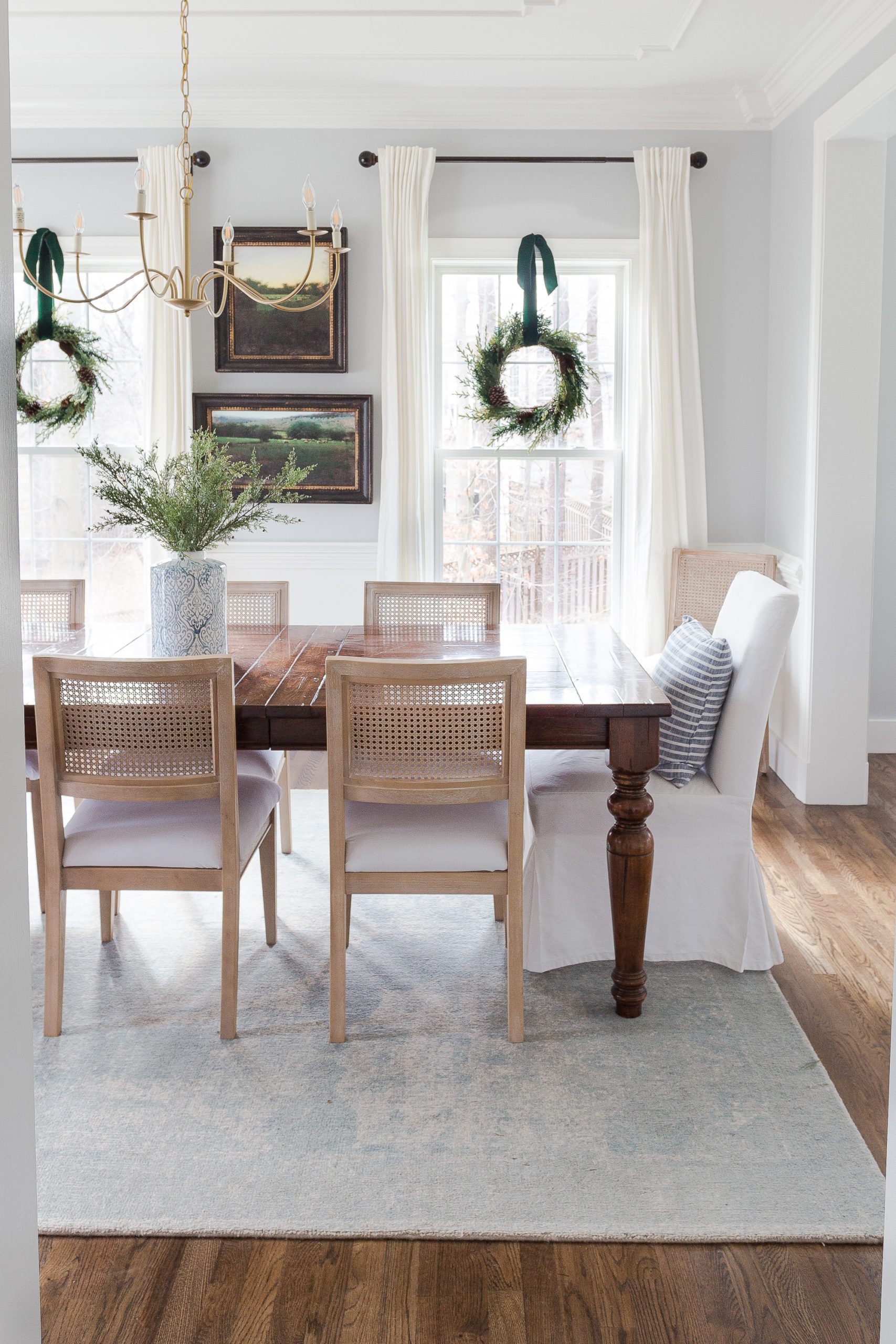 Dining Room Windows Adorned with Wreaths and Green Ribbon — Christmas Window Wreaths