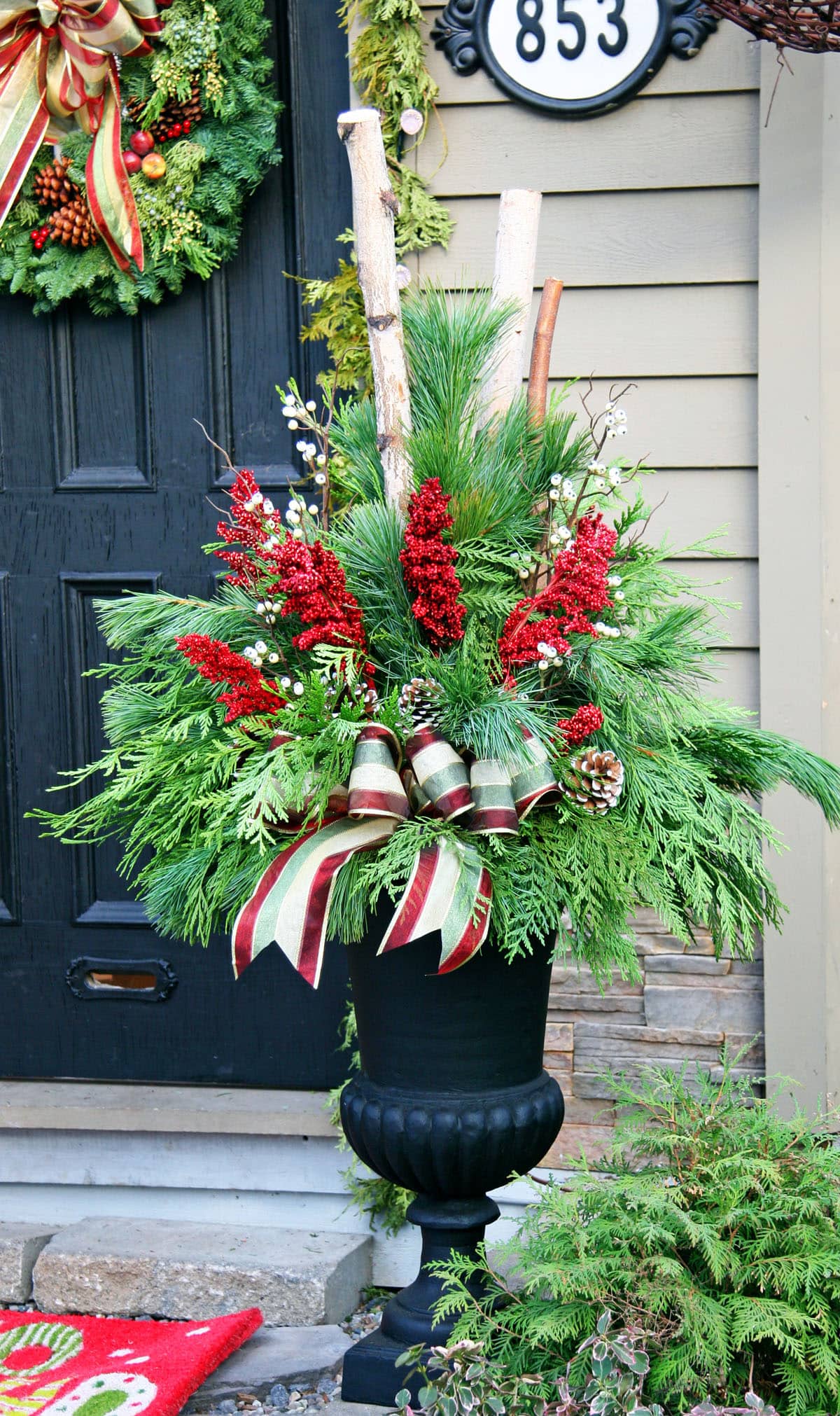 Rustic Urn Overflowing with Lush Christmas Planter Arrangement Rustic Urn Overflowing with Lush Christmas Planter Arrangement — Christmas Yard Decor