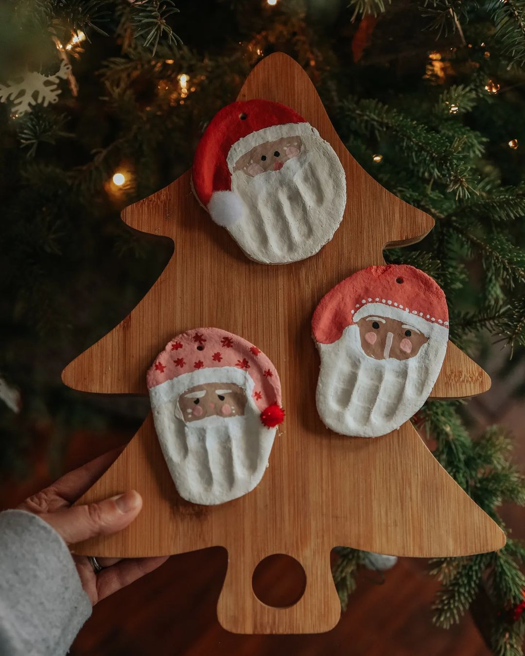 Visual Idea — A Hand Is Visible Holding The Board — Handmade Christmas Ornaments