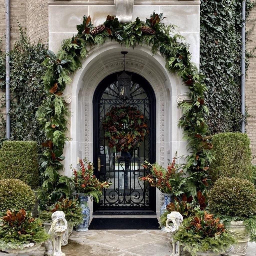 Black Door with Vibrant Red and Gold Garland and 'JOY' Rug Black Door with Vibrant Red and Gold Garland and 'JOY' Rug — Christmas Front Door Decor