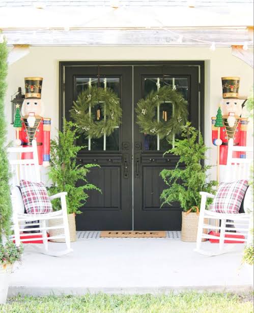 Farmhouse Porch with Nutcracker Figures and White Rocking Chairs — Farmhouse Christmas Porch