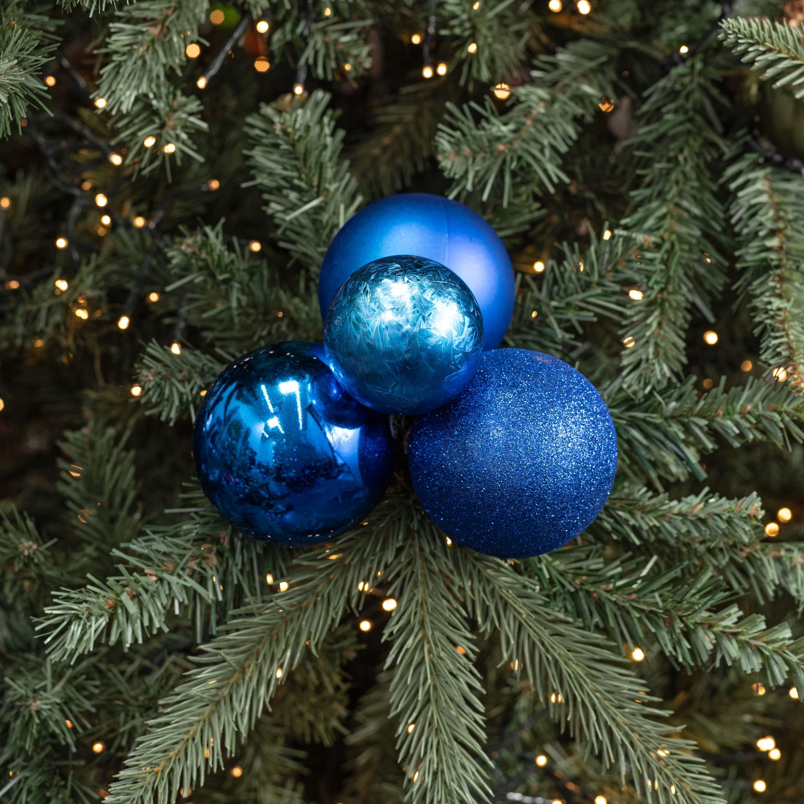 Vibrant Blue Baubles on a Christmas Tree — Blue Christmas Decor