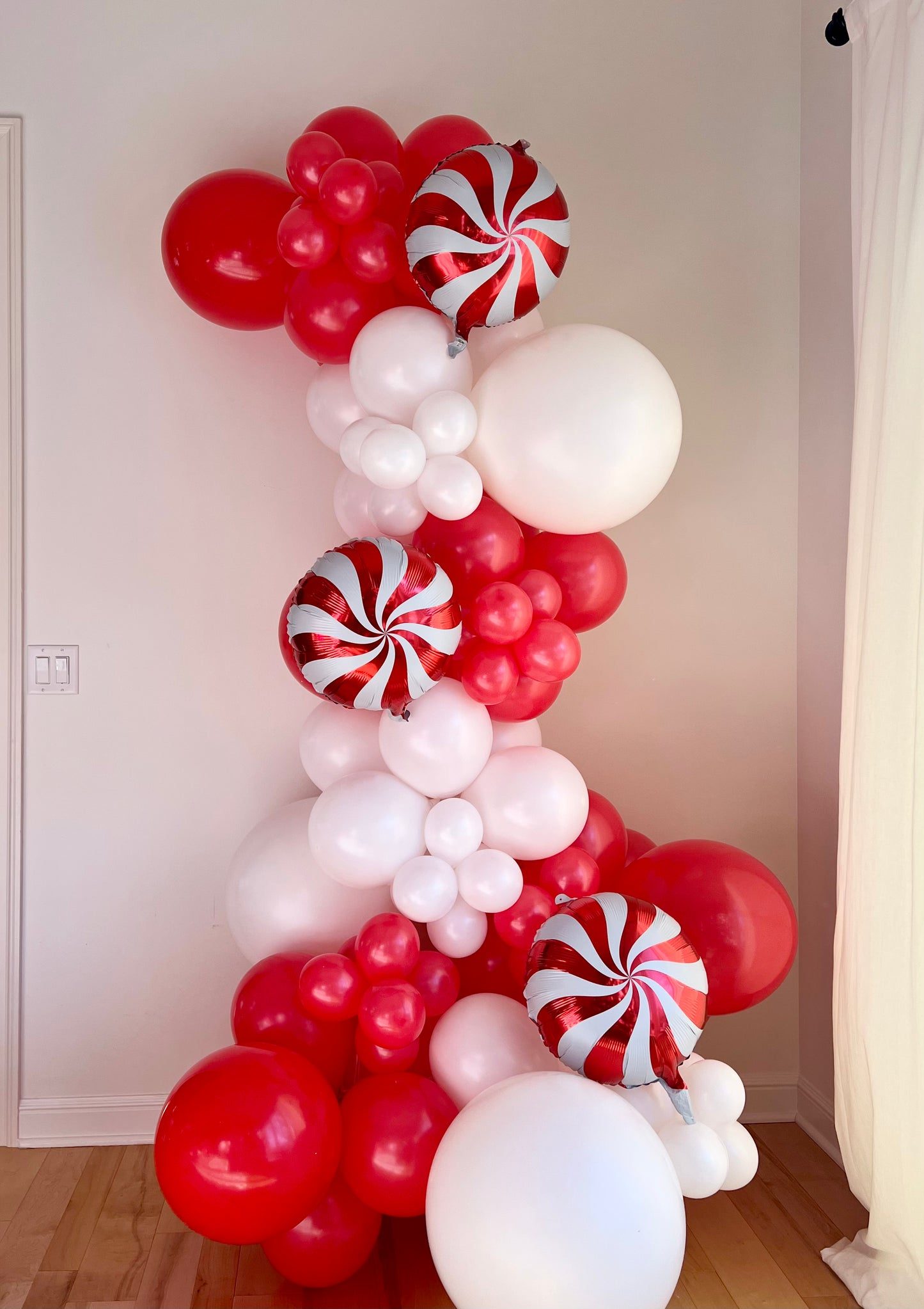 Vertical Red and White Balloon Garland with Candy Canes — Christmas Balloon Garland