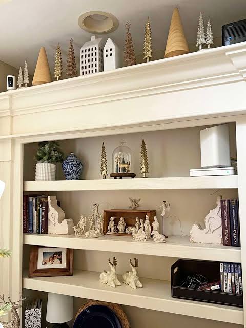 Modern Bookshelf with Decorative Trees and White Houses Modern Bookshelf with Decorative Trees and White Houses — Christmas Bookshelf Decor