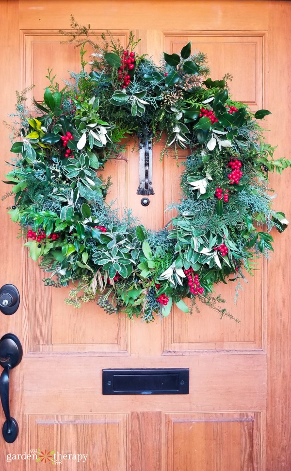 Natural Evergreen Wreath on a Warm Wooden Door Natural Evergreen Wreath on a Warm Wooden Door — Christmas Wreath