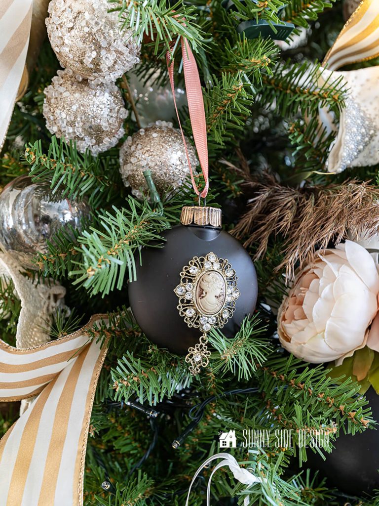 Elegant Matte Black Ornament with Cameo Portrait on a Flocked Tree Elegant Matte Black Ornament with Cameo Portrait on a Flocked Tree — Ornament Christmas Tree