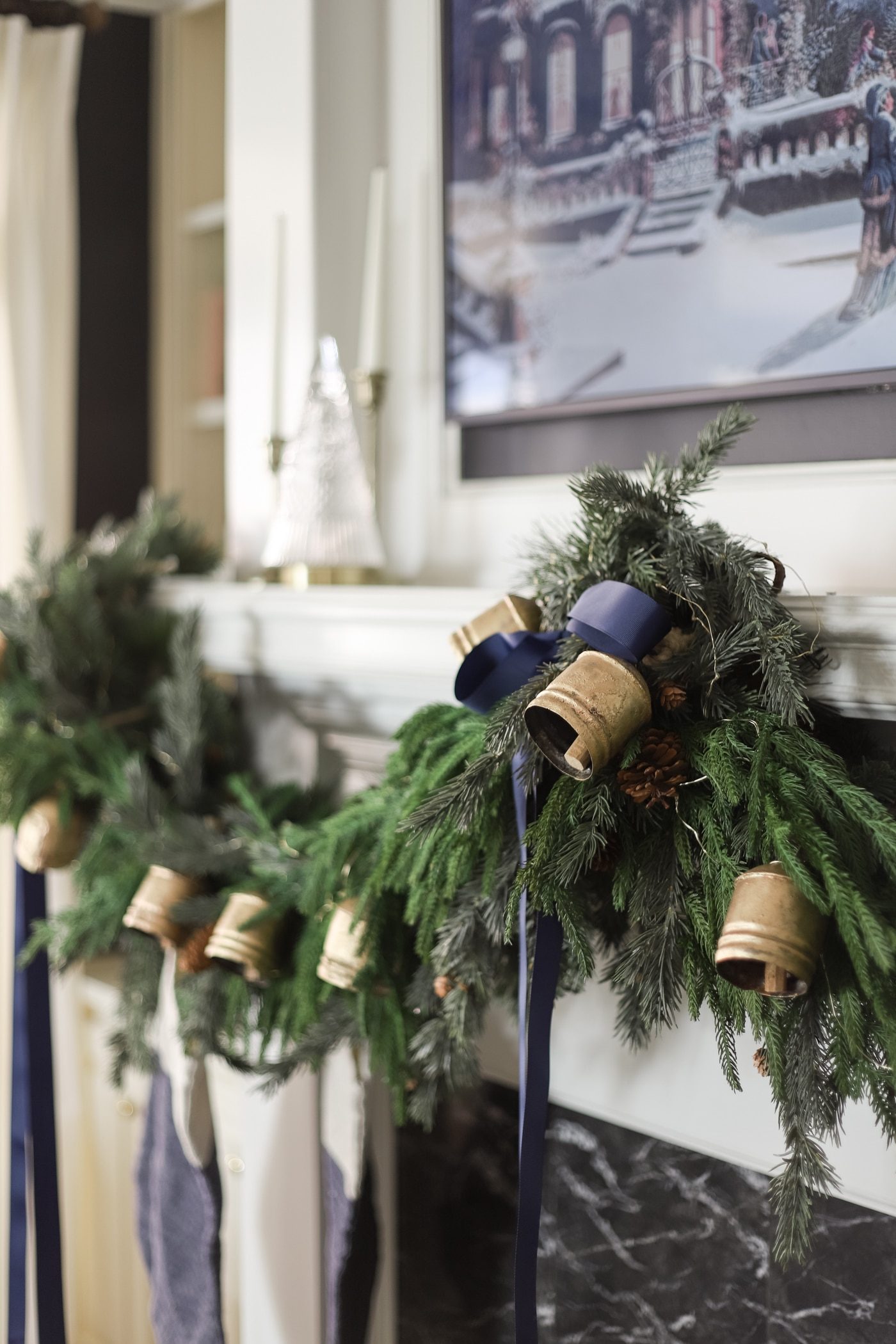 Rustic Garland with Brass Bells and Navy Ribbons on a Marble Mantel Rustic Garland with Brass Bells and Navy Ribbons on a Marble Mantel — Christmas Garland