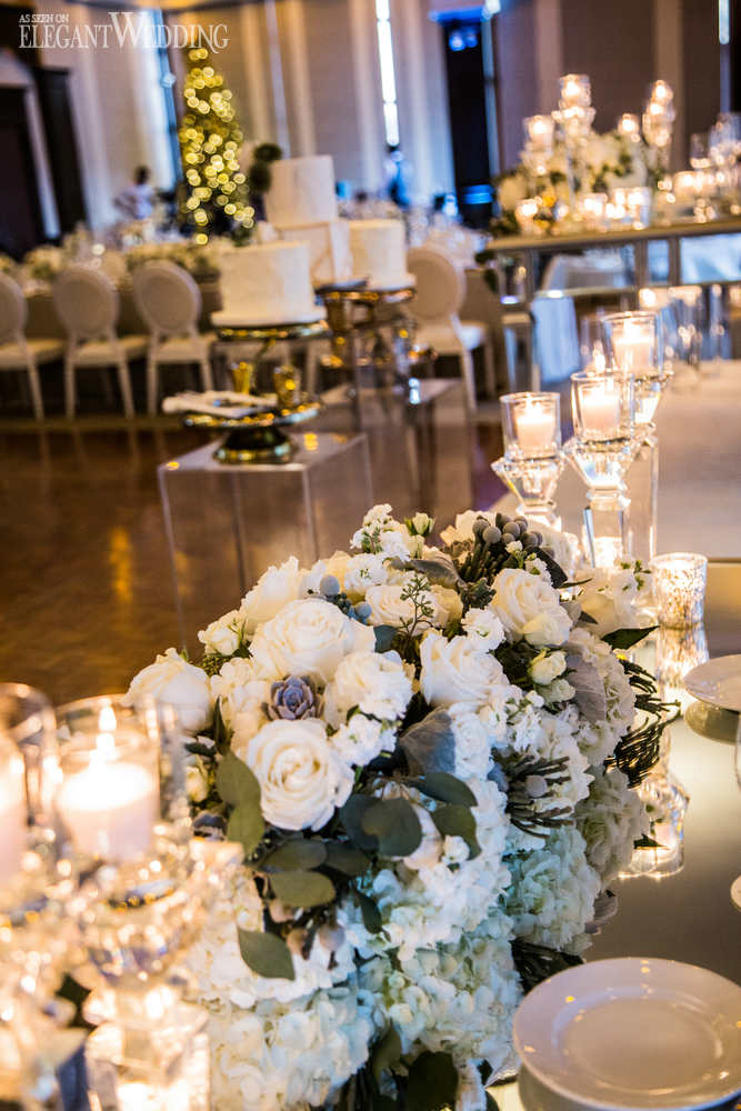 Lush White Floral Arrangement on a Mirrored Table Lush White Floral Arrangement on a Mirrored Table — Christmas Wedding Centerpiece