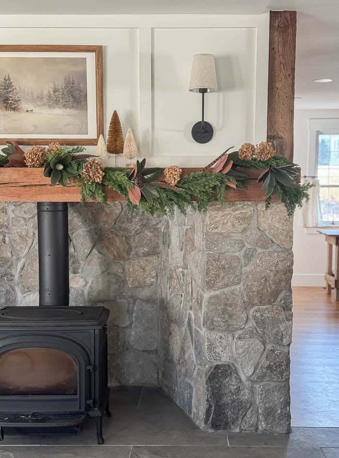Rustic Corner Fireplace with Green Garland Accents Rustic Corner Fireplace with Green Garland Accents — Christmas Fireplace Decor