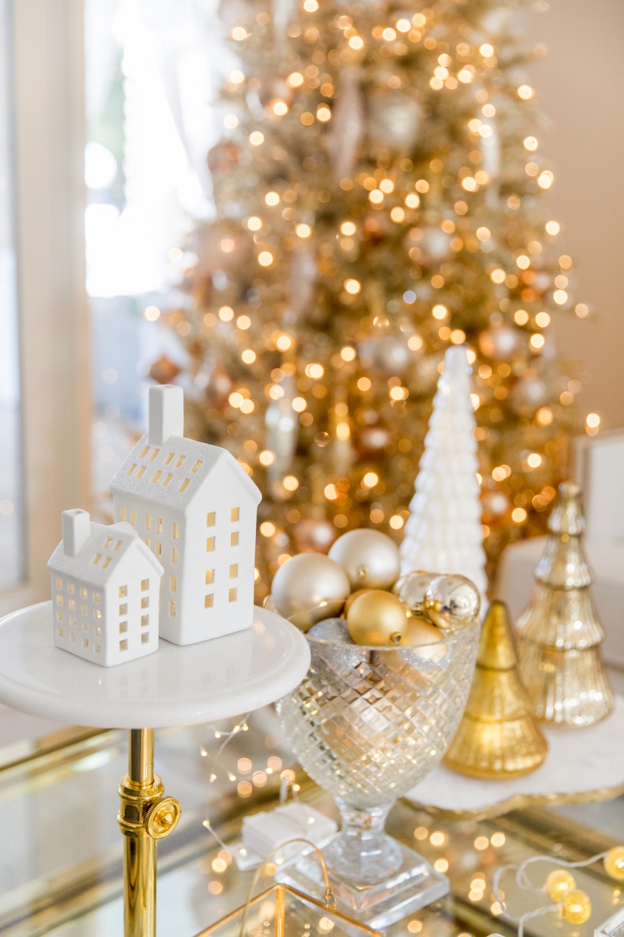 Arrange modern gold decor on a tiered stand Arrange modern gold decor on a tiered stand — Gold Christmas Decor