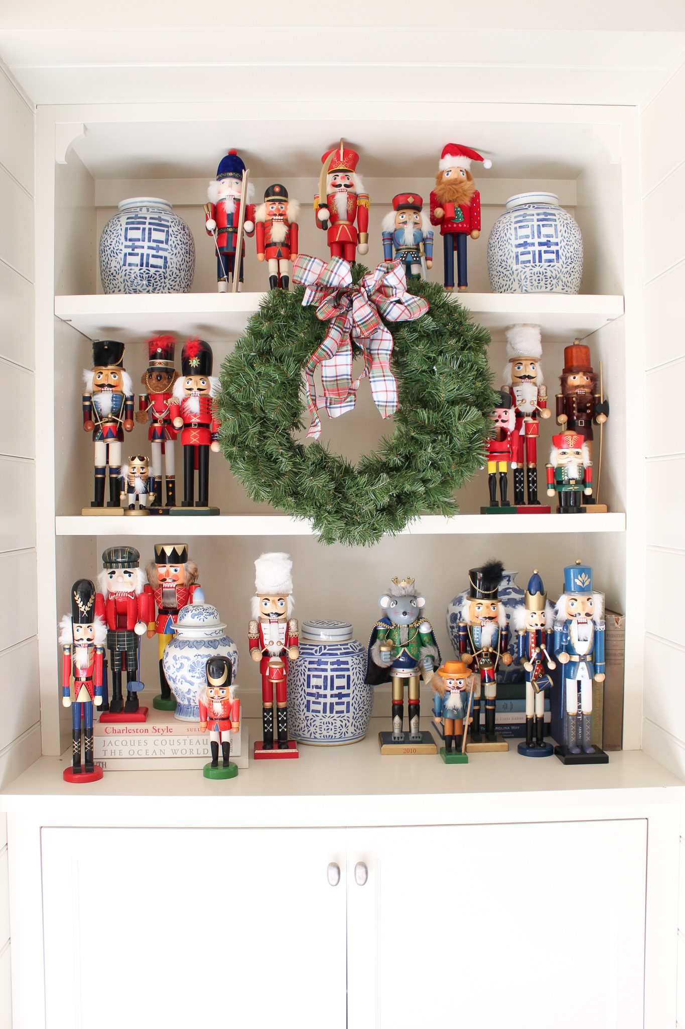 White Shelving Unit Showcasing Abundant Nutcrackers — Nutcracker Display