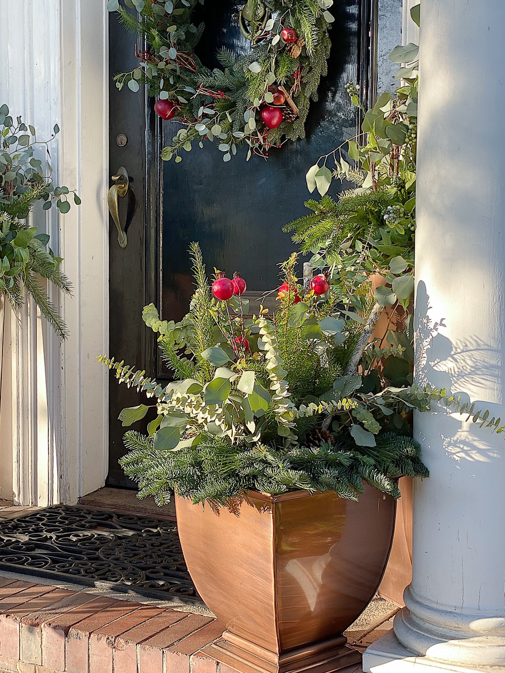 Copper Planter with Eucalyptus and Bright Red Berries Copper Planter with Eucalyptus and Bright Red Berries — Christmas Porch Planters
