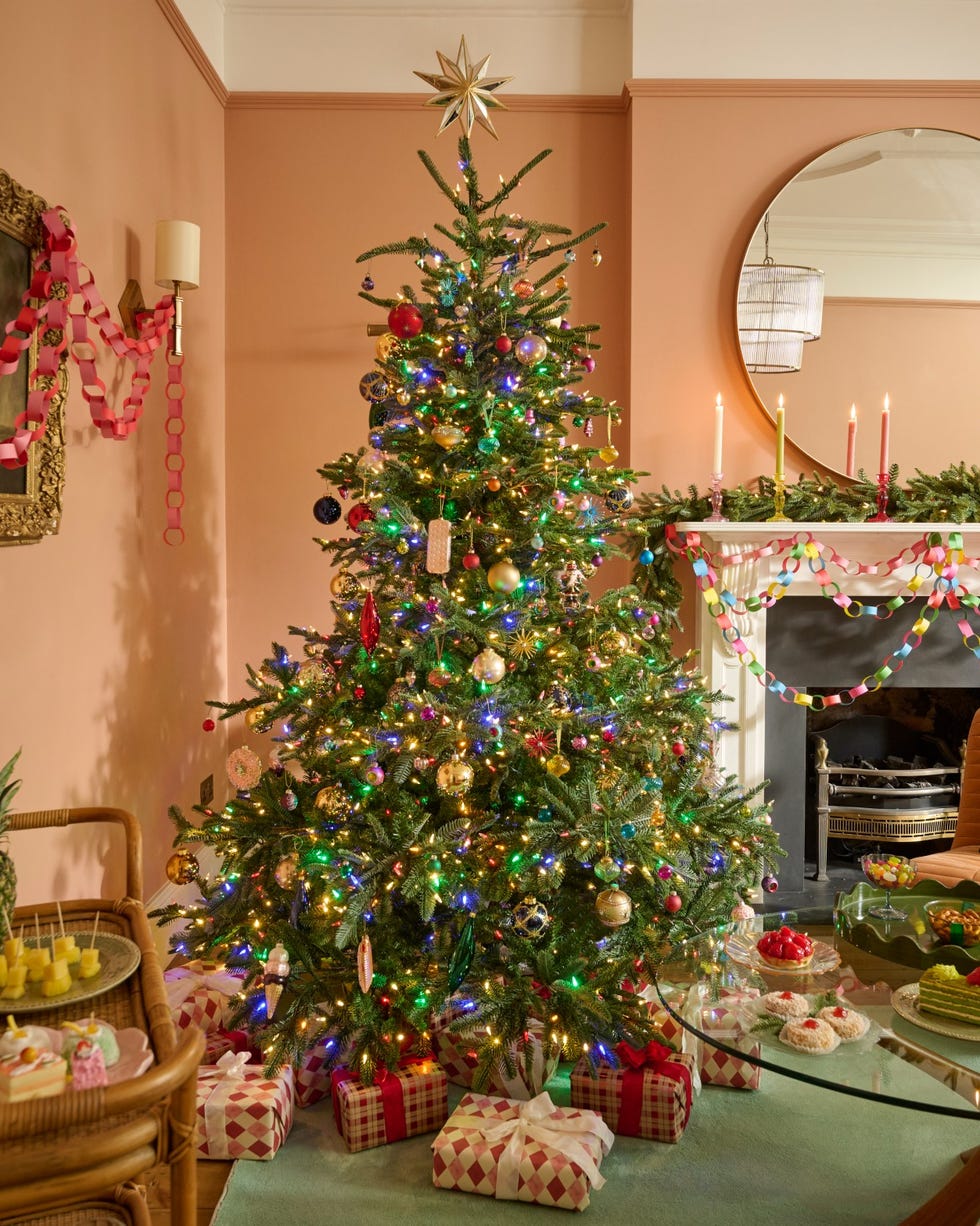 Open Plan Christmas Tree As Focal Point Sophisticated Modern Living Room with Flocked Christmas Tree and Silver Ornaments — M