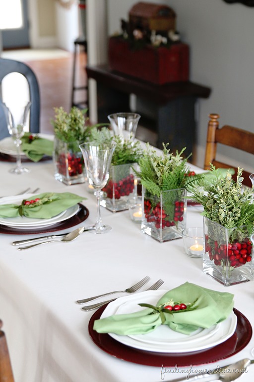 Farmhouse Style with Multiple Small Greenery and Berry Centerpieces Farmhouse Style with Multiple Small Greenery and Berry Centerpieces — Simple Christmas Centerpiece